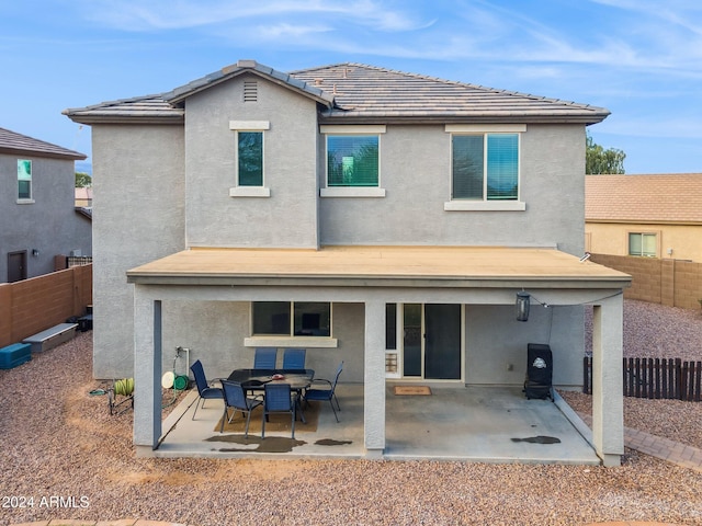 back of house with a patio area