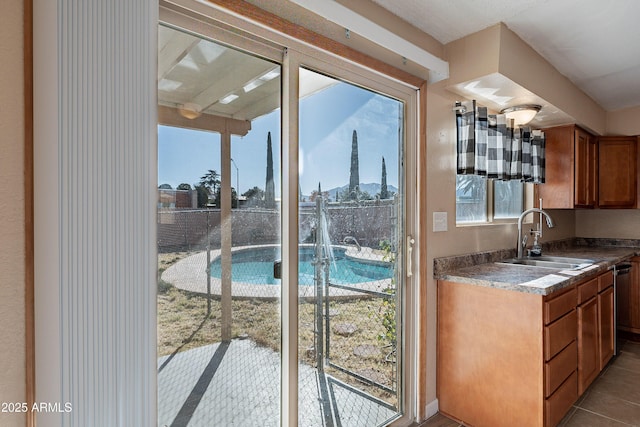 kitchen with tile patterned floors and sink