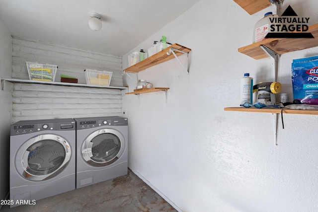 washroom with washing machine and dryer