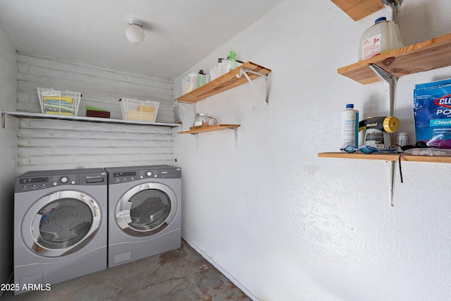 laundry room with washing machine and dryer