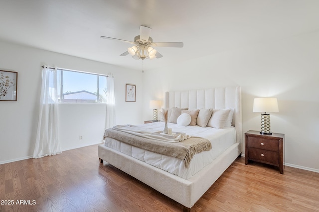 bedroom featuring light hardwood / wood-style flooring and ceiling fan