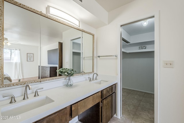 bathroom with vanity, tile patterned floors, and ceiling fan