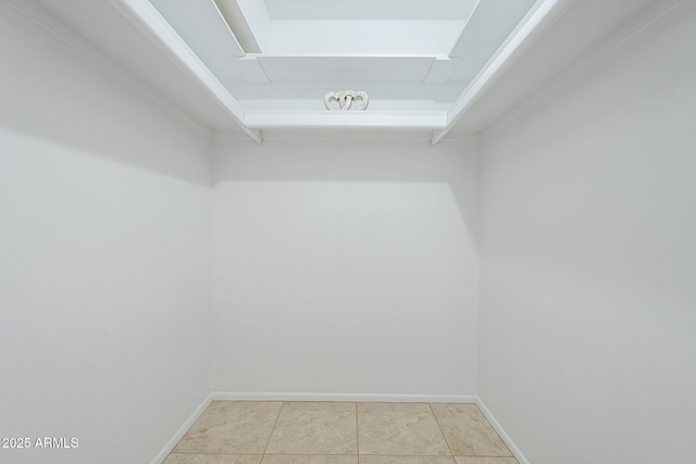 spacious closet featuring light tile patterned floors