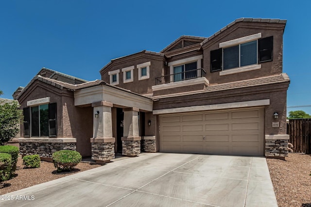 1723 N Hillcrest, Mesa, AZ 85201 - view of front of house featuring stone siding, driveway, a garage, and stucco siding