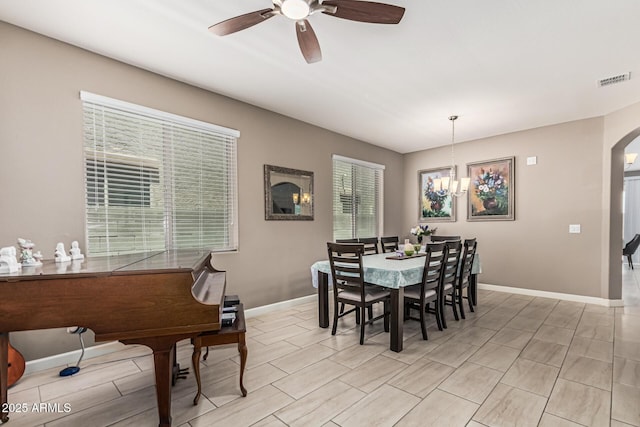 1723 N Hillcrest, Mesa, AZ 85201 - dining area with a ceiling fan, arched walkways, and a chandelier