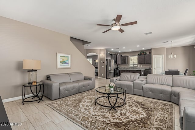 1723 N Hillcrest, Mesa, AZ 85201 - living area featuring ceiling fan, a chandelier, arched walkways, and recessed lighting
