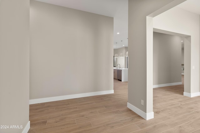 interior space featuring sink and light hardwood / wood-style floors