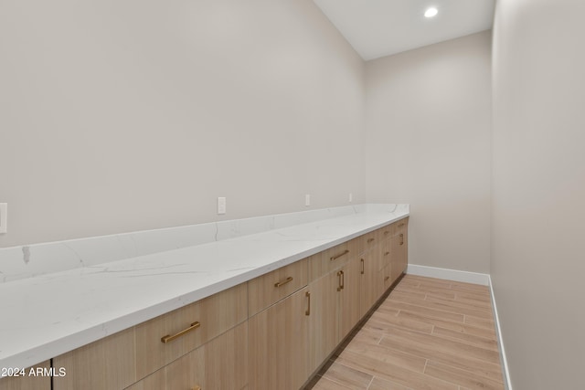 bathroom with hardwood / wood-style flooring