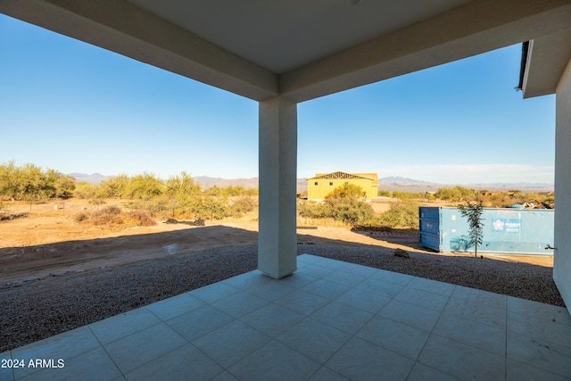 view of patio / terrace featuring a mountain view