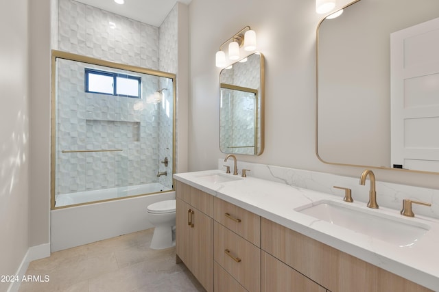 full bathroom with vanity, toilet, tile patterned floors, and bath / shower combo with glass door