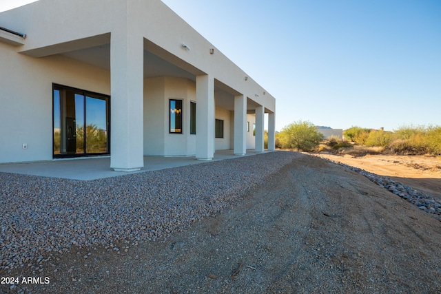 view of home's exterior featuring a patio area