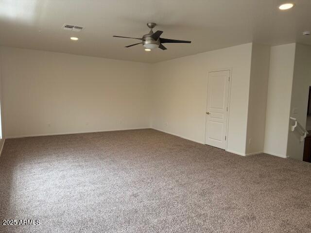 spare room featuring recessed lighting, ceiling fan, carpet floors, and visible vents