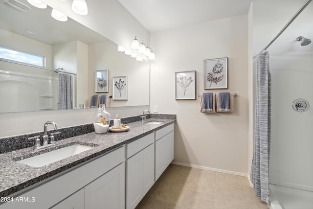 bathroom featuring vanity, a shower with curtain, and tile patterned flooring