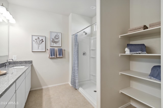 bathroom with vanity, tile patterned floors, and a shower with shower curtain