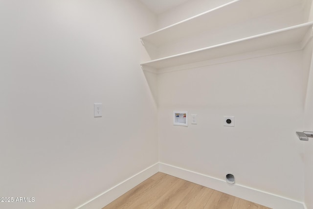 laundry area featuring washer hookup, light wood finished floors, electric dryer hookup, laundry area, and baseboards