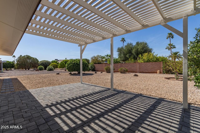 view of patio / terrace with a fenced backyard and a pergola