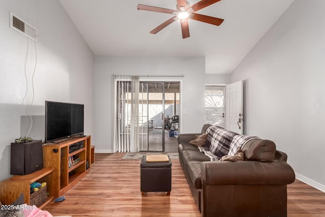 living room with ceiling fan and hardwood / wood-style floors