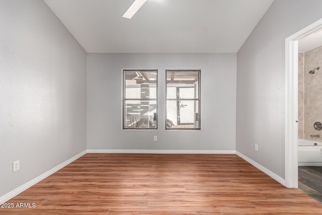 unfurnished room with light hardwood / wood-style floors and ceiling fan