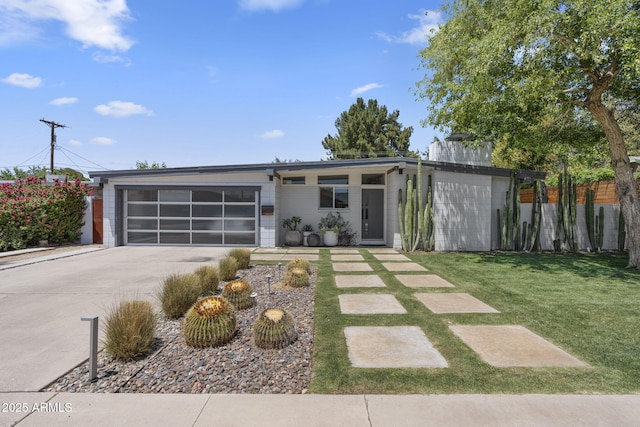 3402 E Sells Dr, Phoenix, AZ 85018 - mid-century inspired home with concrete driveway and an attached garage
