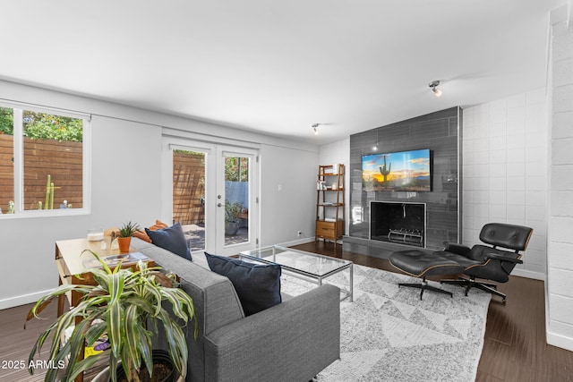 3402 E Sells Dr, Phoenix, AZ 85018 - living room featuring healthy amount of natural light, wood finished floors, french doors, and lofted ceiling