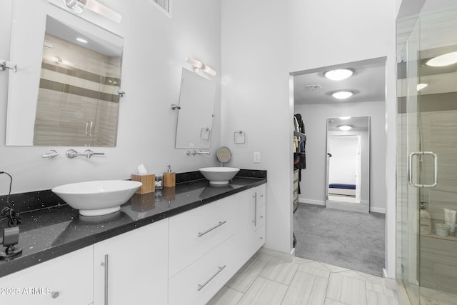 3402 E Sells Dr, Phoenix, AZ 85018 - bathroom featuring a shower stall and double vanity
