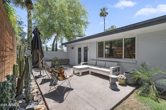 3402 E Sells Dr, Phoenix, AZ 85018 - fenced backyard featuring french doors, outdoor lounge area, and a patio