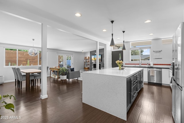 3402 E Sells Dr, Phoenix, AZ 85018 - kitchen with appliances with stainless steel finishes, healthy amount of natural light, recessed lighting, hanging light fixtures, and a sink