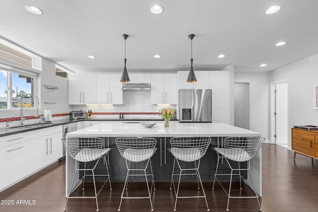 3402 E Sells Dr, Phoenix, AZ 85018 - kitchen featuring stainless steel appliances, a large island, recessed lighting, a sink, and white cabinets