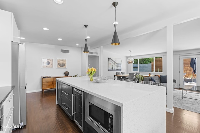 3402 E Sells Dr, Phoenix, AZ 85018 - kitchen with dark cabinets, appliances with stainless steel finishes, recessed lighting, beverage cooler, and white cabinetry