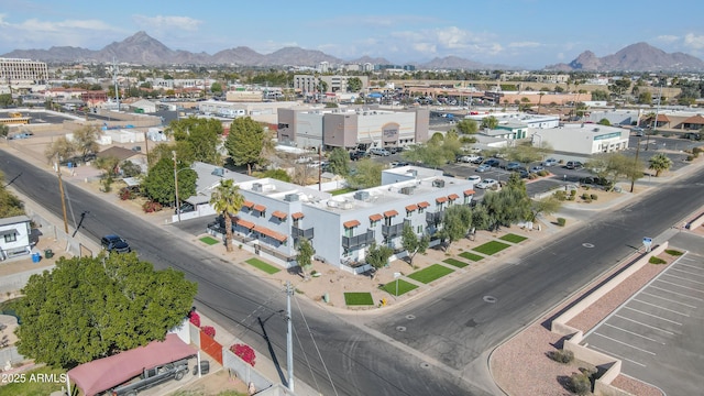 birds eye view of property with a mountain view