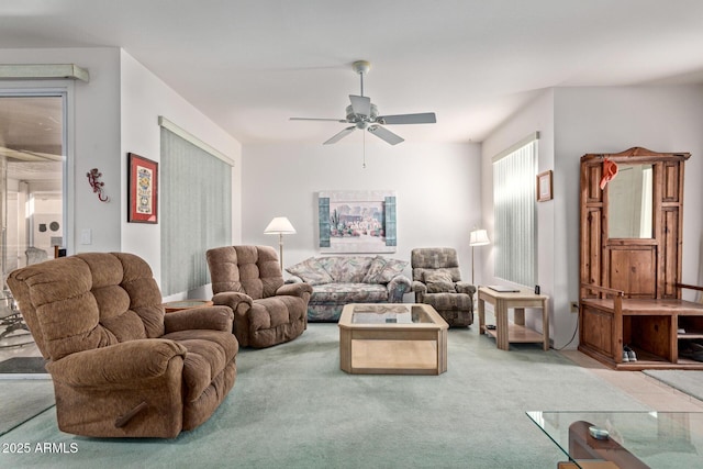 living room with ceiling fan and carpet flooring