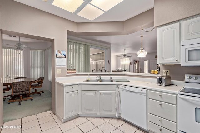 kitchen with sink, white appliances, light tile patterned floors, ceiling fan, and white cabinetry