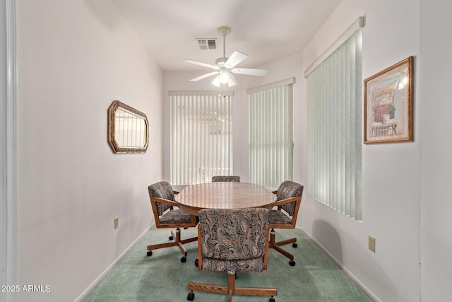 dining area featuring ceiling fan and carpet floors