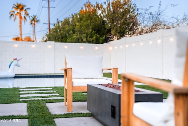 view of yard featuring a fire pit and a water view
