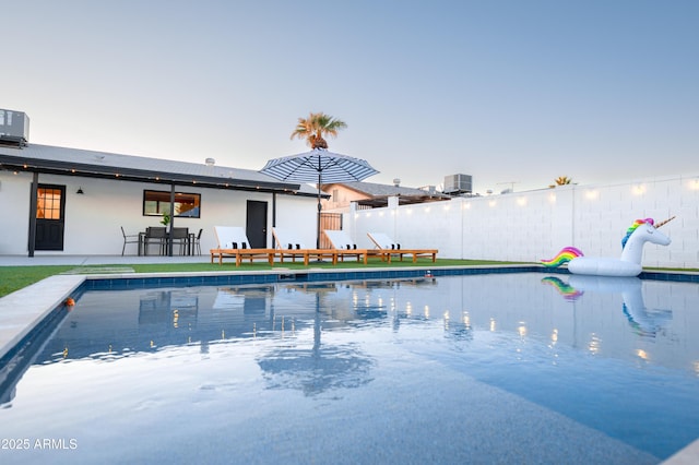 view of pool with fence and a patio area