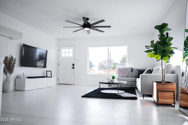 living area featuring ceiling fan