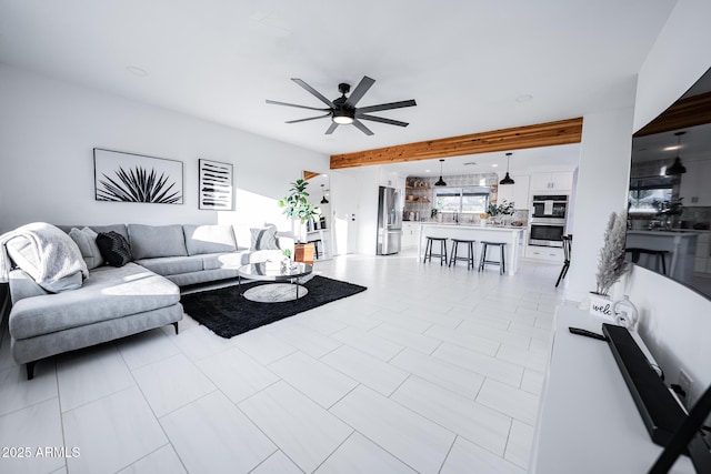 living area featuring a ceiling fan