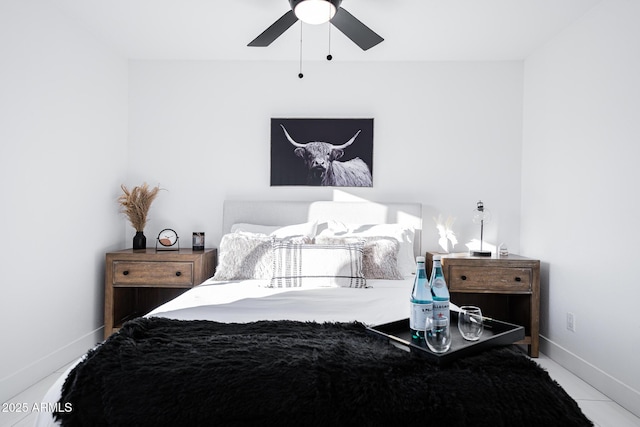 bedroom featuring baseboards and ceiling fan