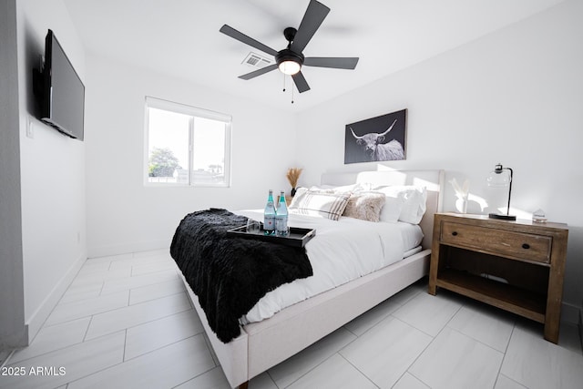 bedroom with baseboards and a ceiling fan