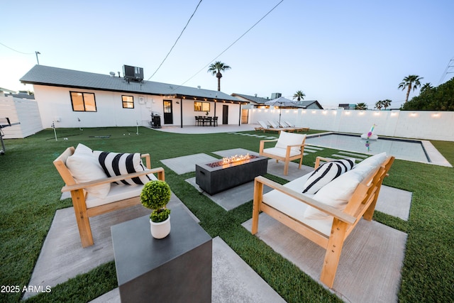 view of patio featuring an outdoor living space with a fire pit and central air condition unit