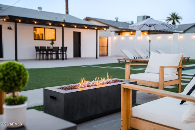 view of patio / terrace featuring an outdoor fire pit