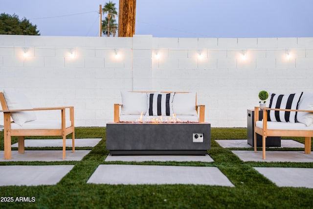 view of yard with an outdoor fire pit and fence