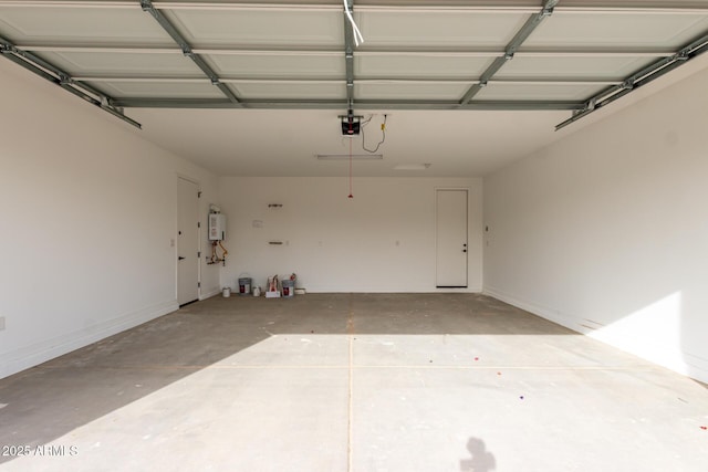 garage with a garage door opener and water heater