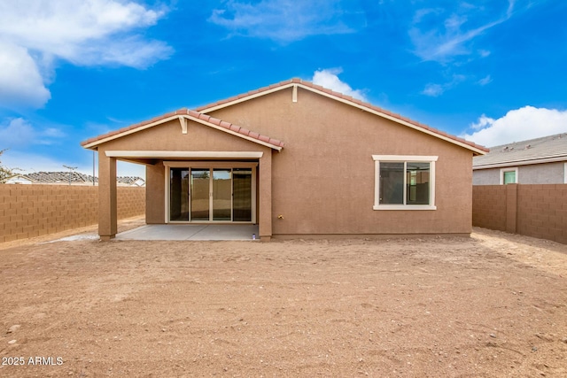 rear view of property with a patio area