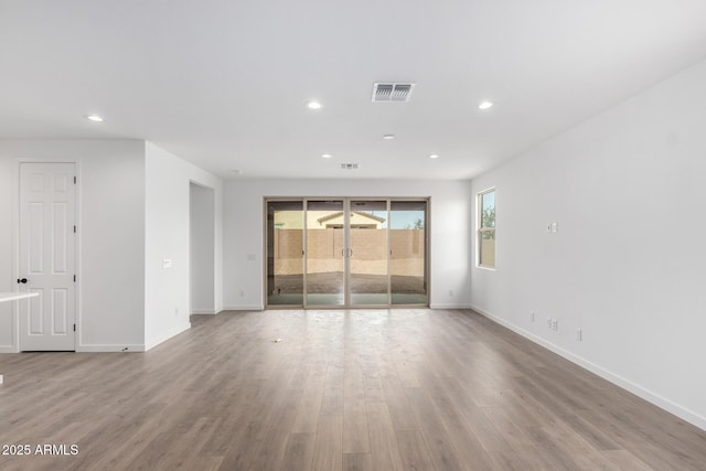 empty room with wood-type flooring