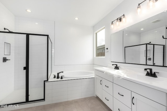 bathroom featuring tile patterned floors, vanity, and separate shower and tub