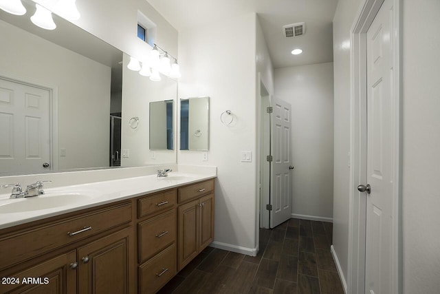 bathroom featuring hardwood / wood-style floors and vanity