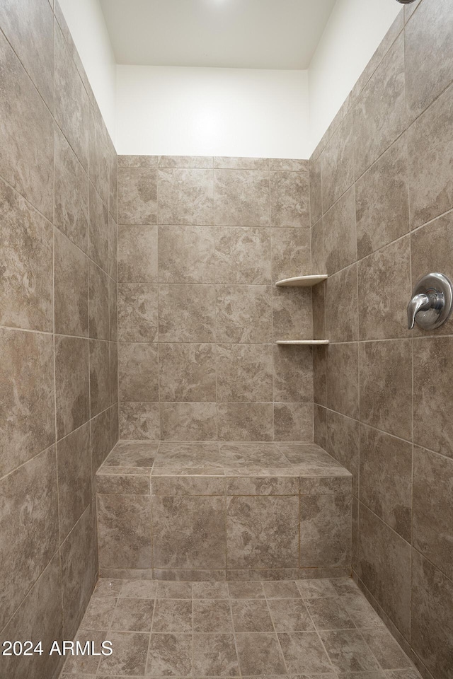 bathroom with tiled shower