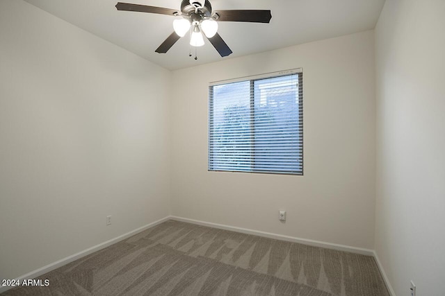 empty room with carpet and ceiling fan