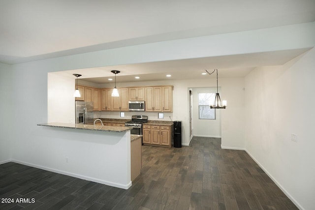 kitchen featuring appliances with stainless steel finishes, light stone counters, dark wood-type flooring, light brown cabinets, and an inviting chandelier